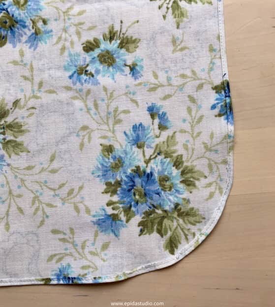 hemmed edge of apron.