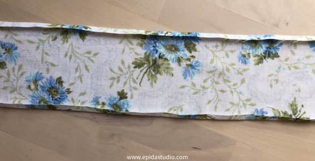 apron tie with edges folded over.