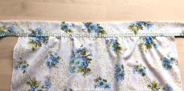 apron band attached with decorative stitching.