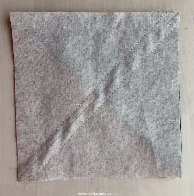 square with diagonal stitching.