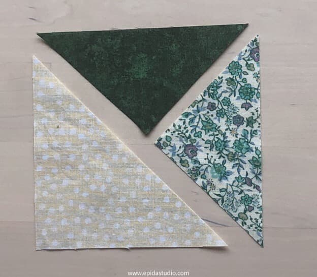 triangles laid out for split half square triangle unit.