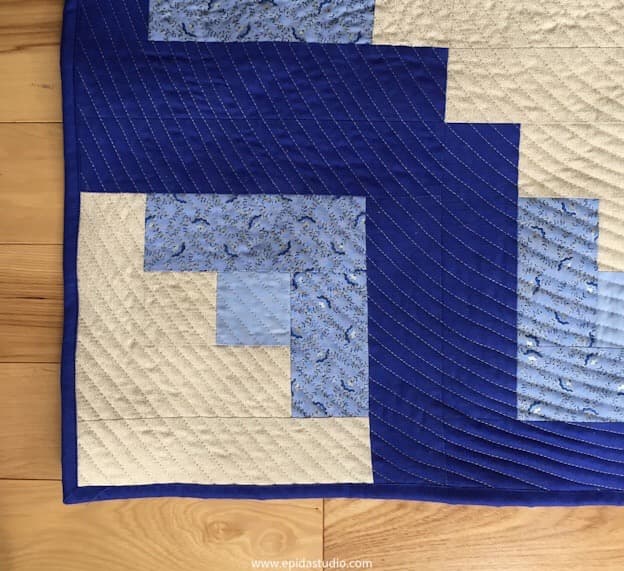 blue and white log cabin square baby quilt