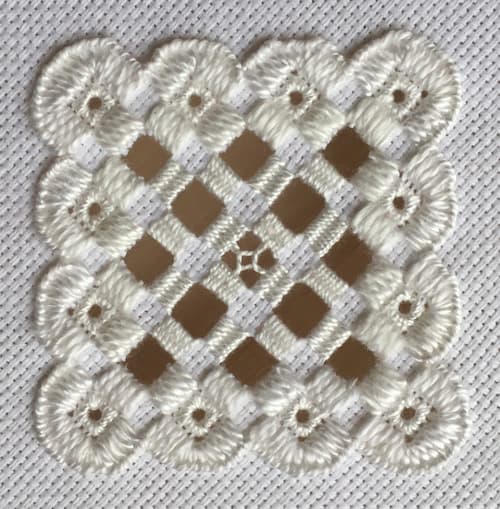 white hardanger embroidery sample.